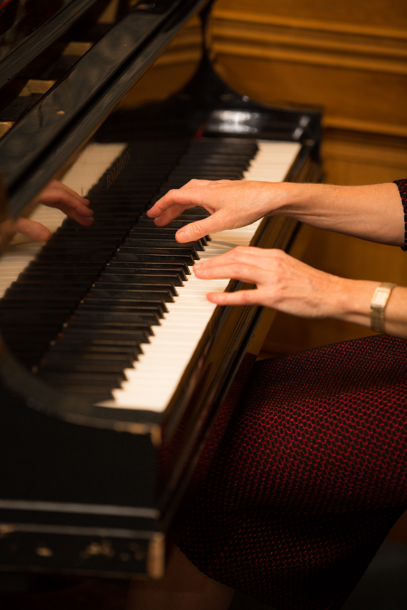 Fingers floating over piano keys